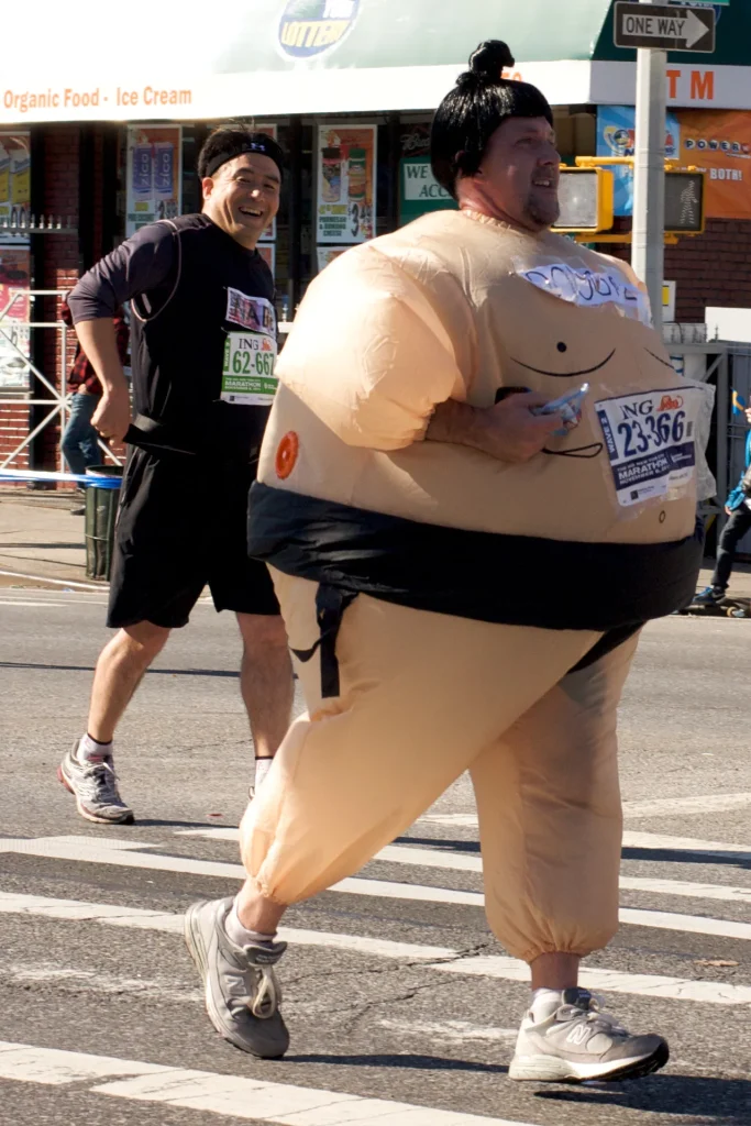 Runner in an inflatable sumo suit at a race