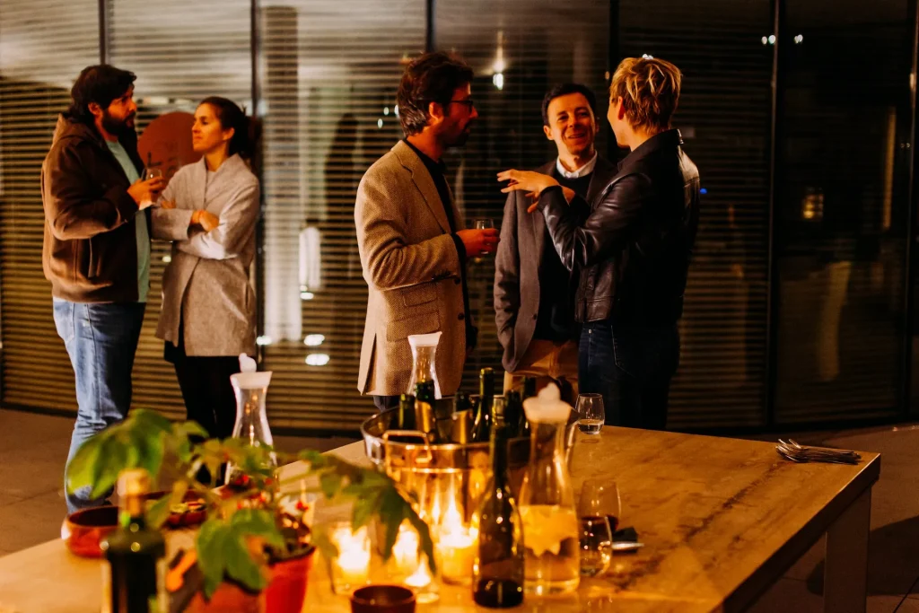Guests chatting at an evening drinks reception